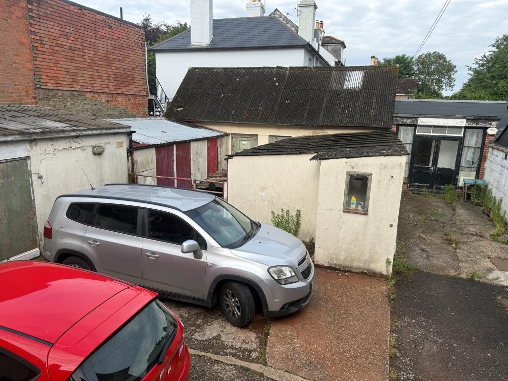 Lot: 22 - SUBSTANTIAL MIXED USE PERIOD PROPERTY WITH DEVELOPMENT POTENTIAL - Outbuildings and yard showing workshop and salon